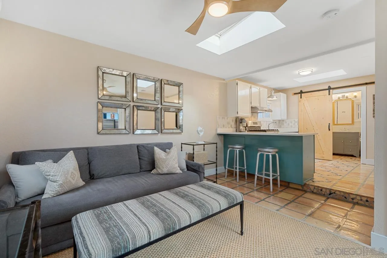 733 Stratford Drive Encinitas, CA 92024 - Photo 41 of 46 a living room with furniture and a fireplace