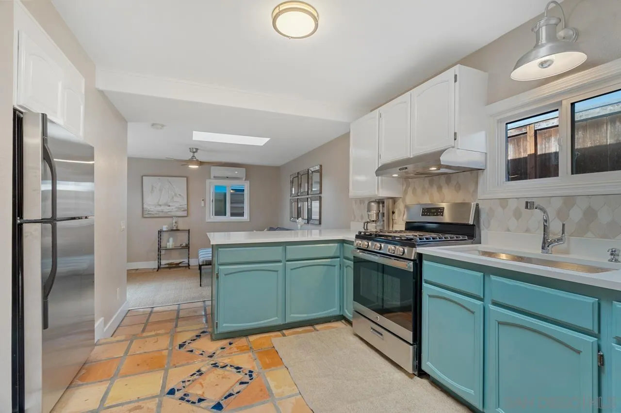 733 Stratford Drive Encinitas, CA 92024 - Photo 42 of 46 a kitchen with stainless steel appliances granite countertop a sink stove and refrigerator