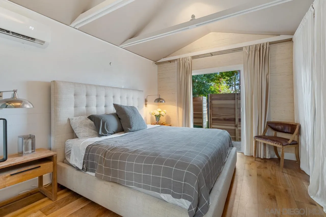 733 Stratford Drive Encinitas, CA 92024 - Photo 44 of 46 a bedroom with a bed and a chair