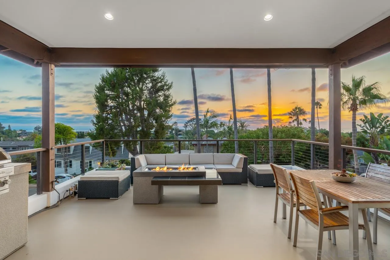 733 Stratford Drive Encinitas, CA 92024 - Photo 6 of 46 a living room with patio furniture and a floor to ceiling window