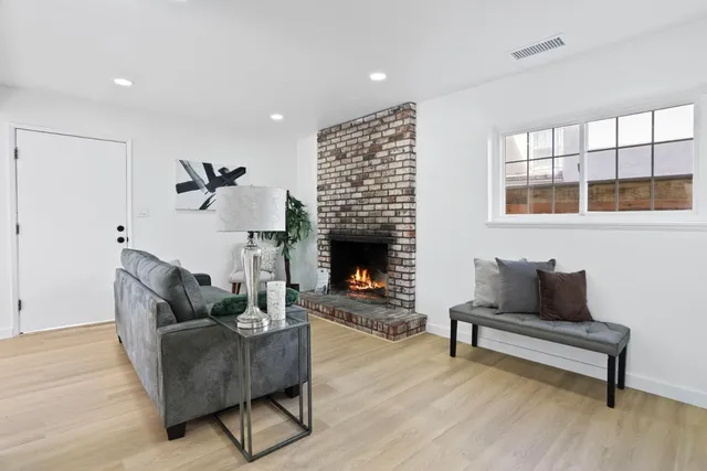 a bedroom with furniture and a wooden floor
