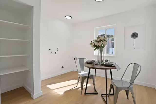 a bathroom with a granite countertop toilet and a shower