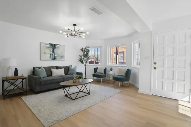 a view of a dining room with furniture and a window