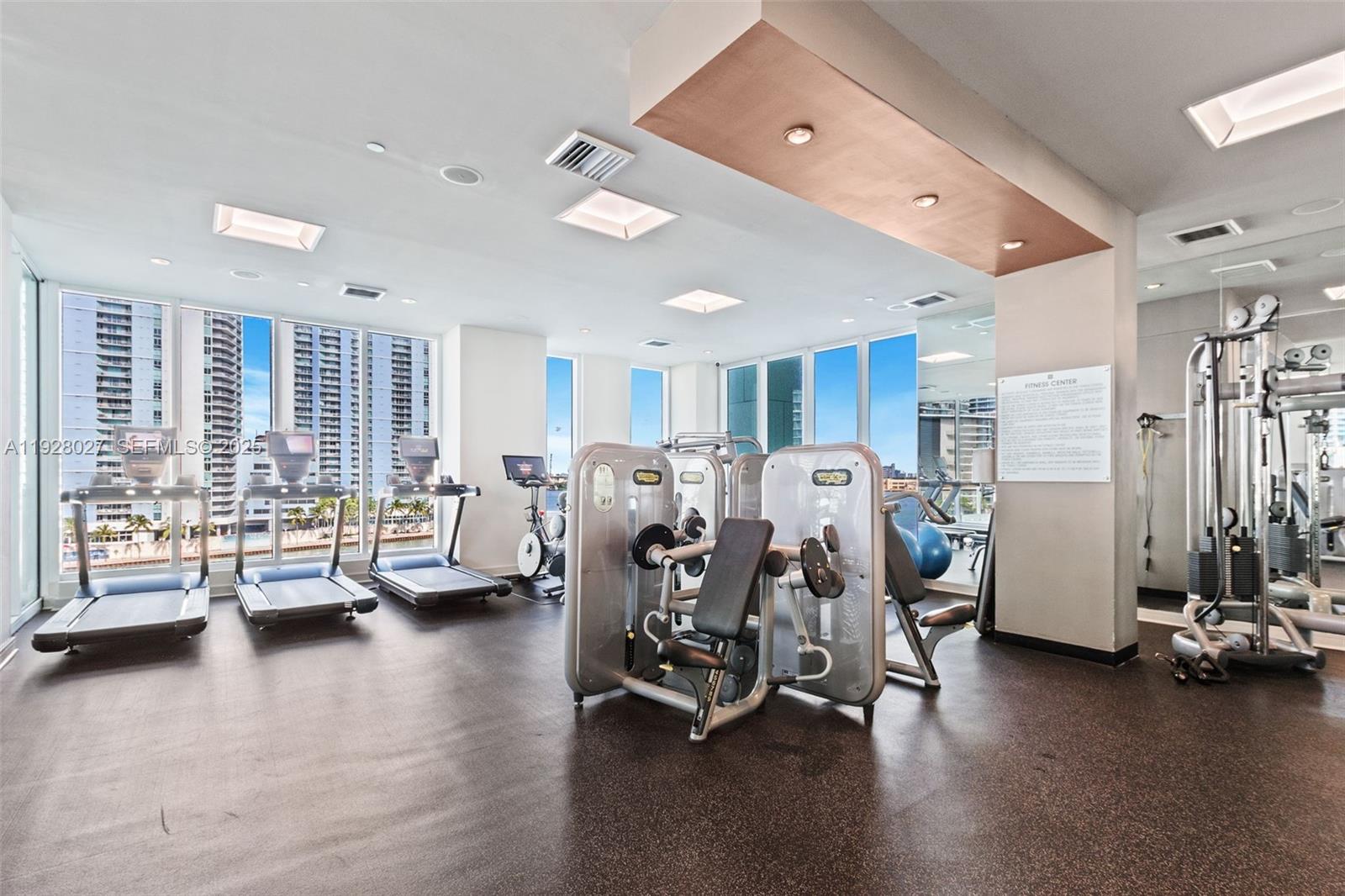 900 Brickell Key Boulevard, Unit 2002 Miami, FL 33131 - Photo 19 of 28 a view of a room with gym equipment