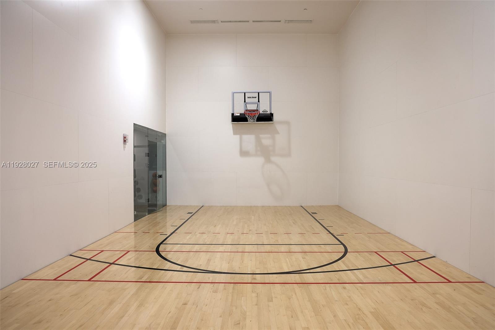 900 Brickell Key Boulevard, Unit 2002 Miami, FL 33131 - Photo 20 of 28 a view of a room with basketball court