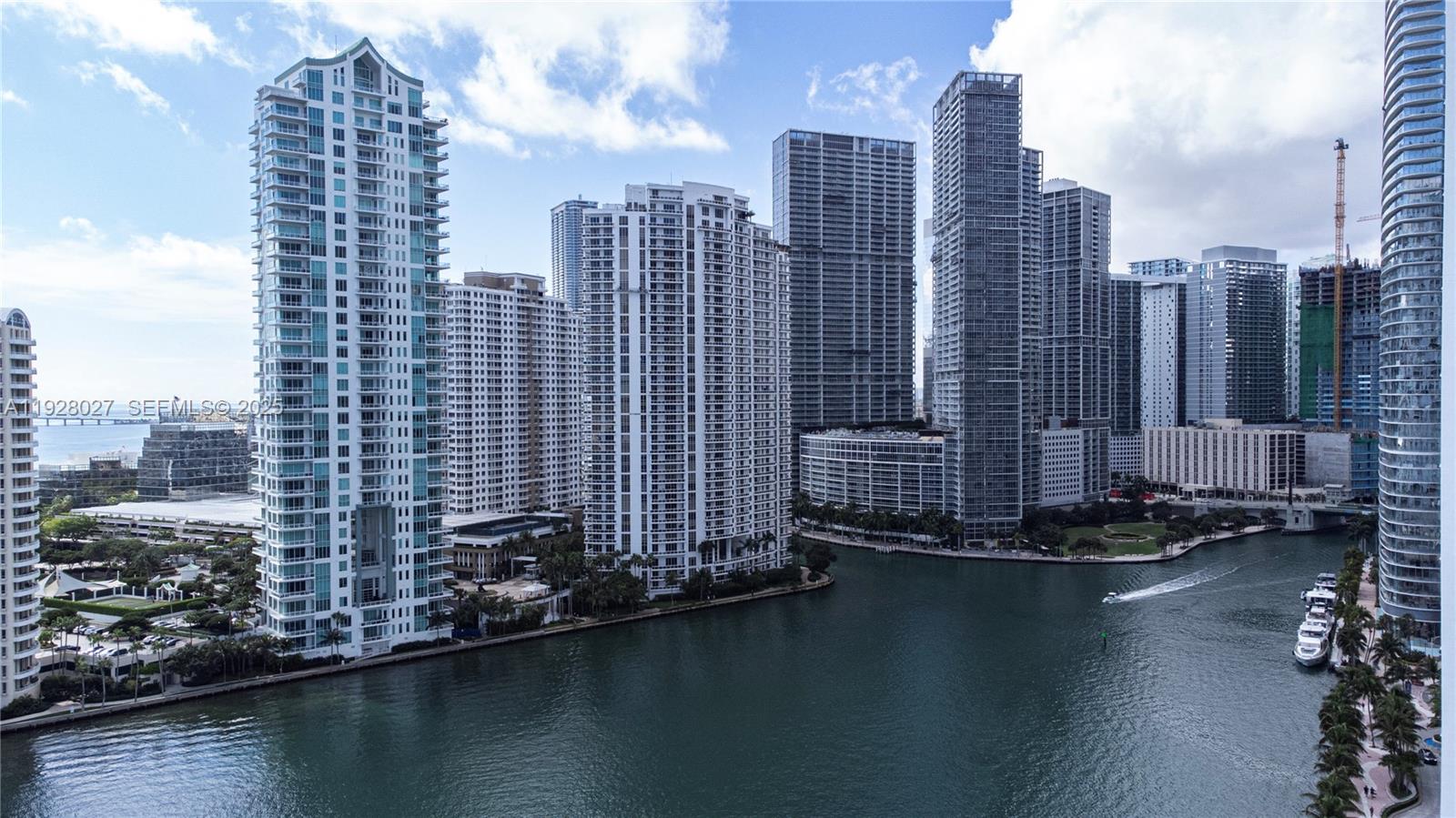 900 Brickell Key Boulevard, Unit 2002 Miami, FL 33131 - Photo 28 of 28 a view of a lake with tall buildings