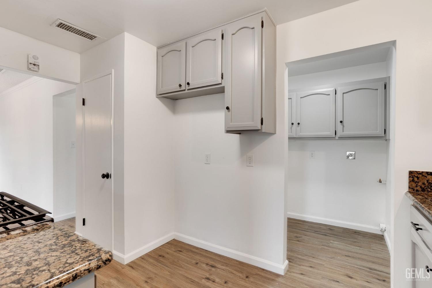 Undisclosed Address Bakersfield, CA 93312 - Photo 13 of 29 a view of kitchen with wooden floor