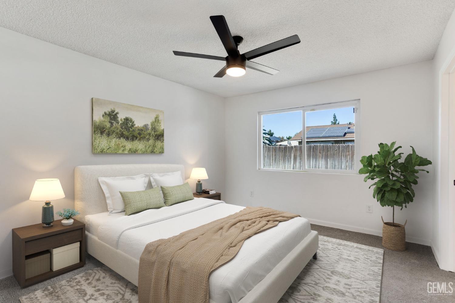 Undisclosed Address Bakersfield, CA 93312 - Photo 14 of 29 a bedroom with a bed and a potted plant