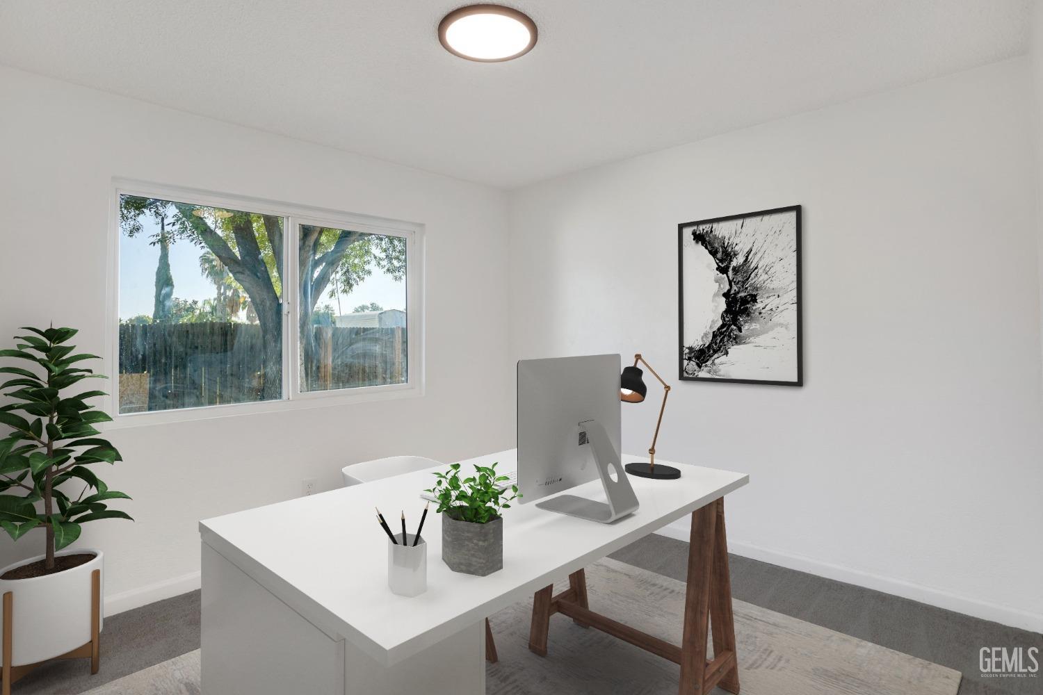 Undisclosed Address Bakersfield, CA 93312 - Photo 18 of 29 a view of a workspace with a table and chair in a room