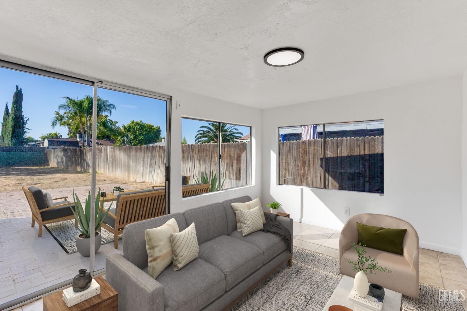 Undisclosed Address Bakersfield, CA 93312 - Photo 19 of 29 a living room with furniture and a large window