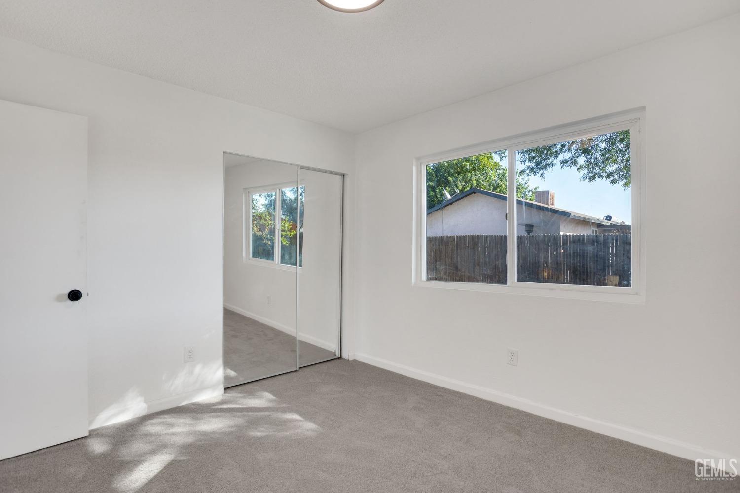 Undisclosed Address Bakersfield, CA 93312 - Photo 22 of 29 an empty room with a window
