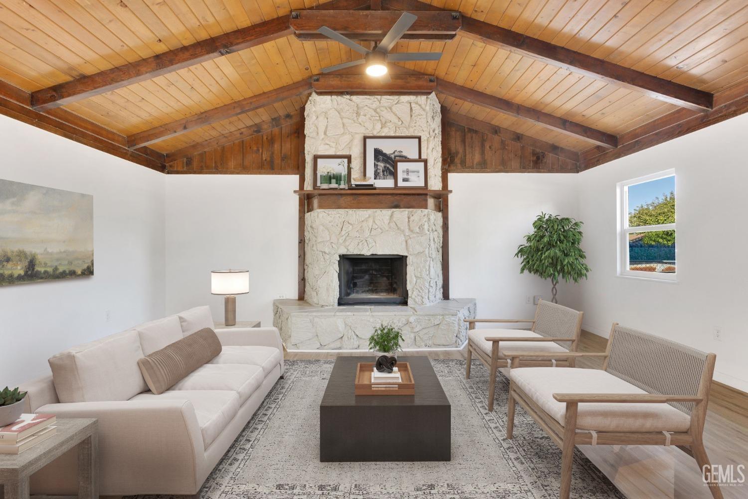 Undisclosed Address Bakersfield, CA 93312 - Photo 4 of 29 a living room with furniture and a fireplace