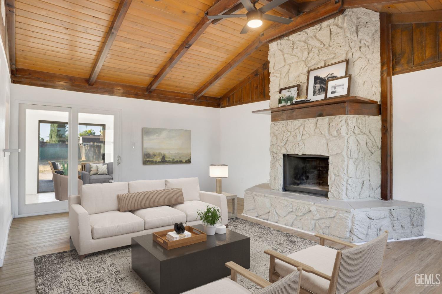 Undisclosed Address Bakersfield, CA 93312 - Photo 5 of 29 a living room with furniture and a fireplace