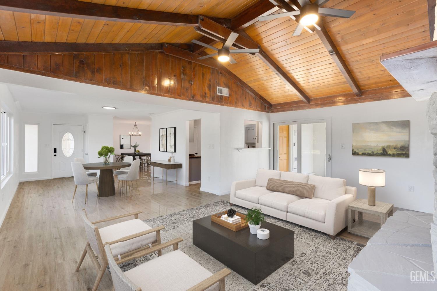 Undisclosed Address Bakersfield, CA 93312 - Photo 6 of 29 a living room with furniture and a chandelier