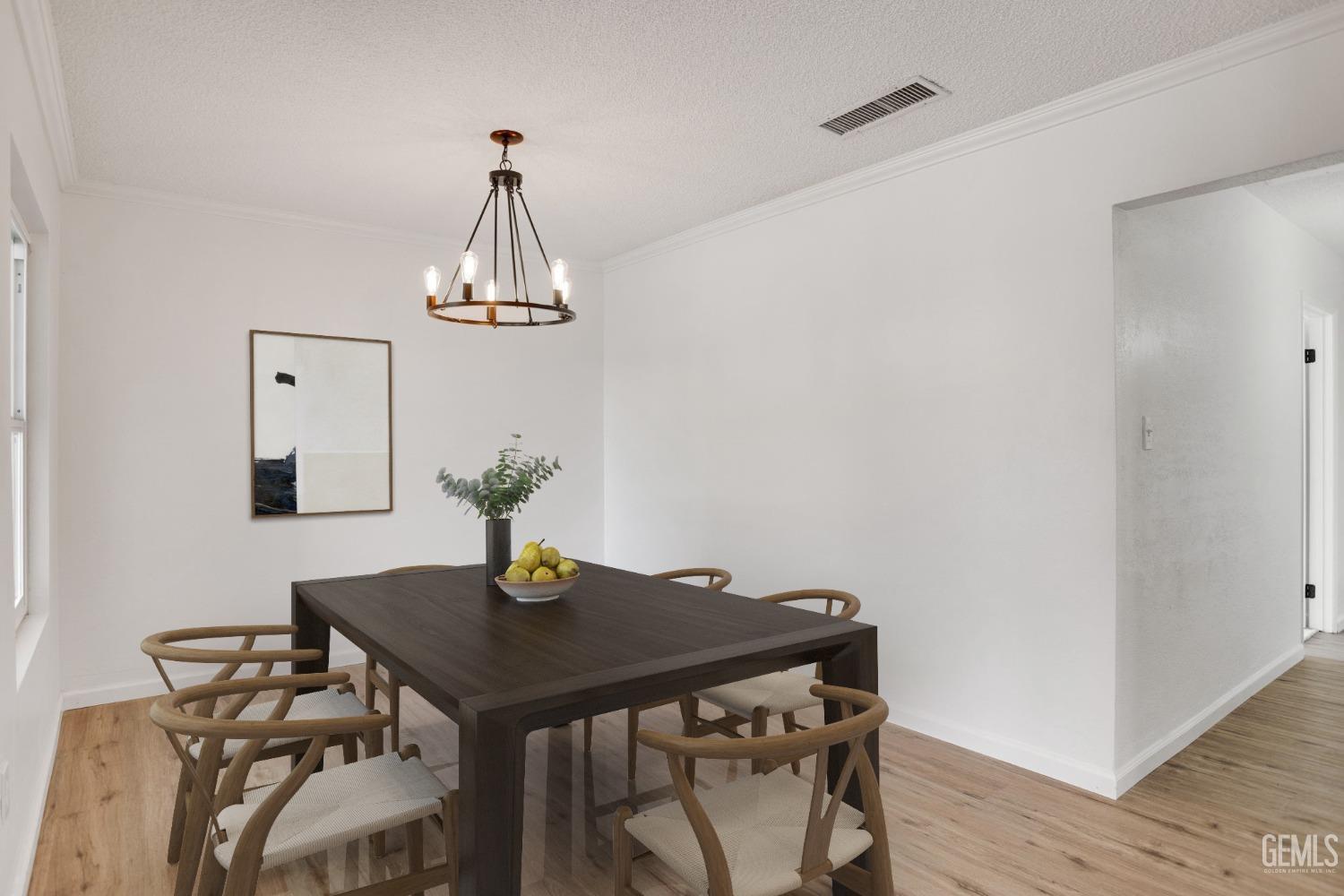 Undisclosed Address Bakersfield, CA 93312 - Photo 7 of 29 a view of a dining room with a table and chairs