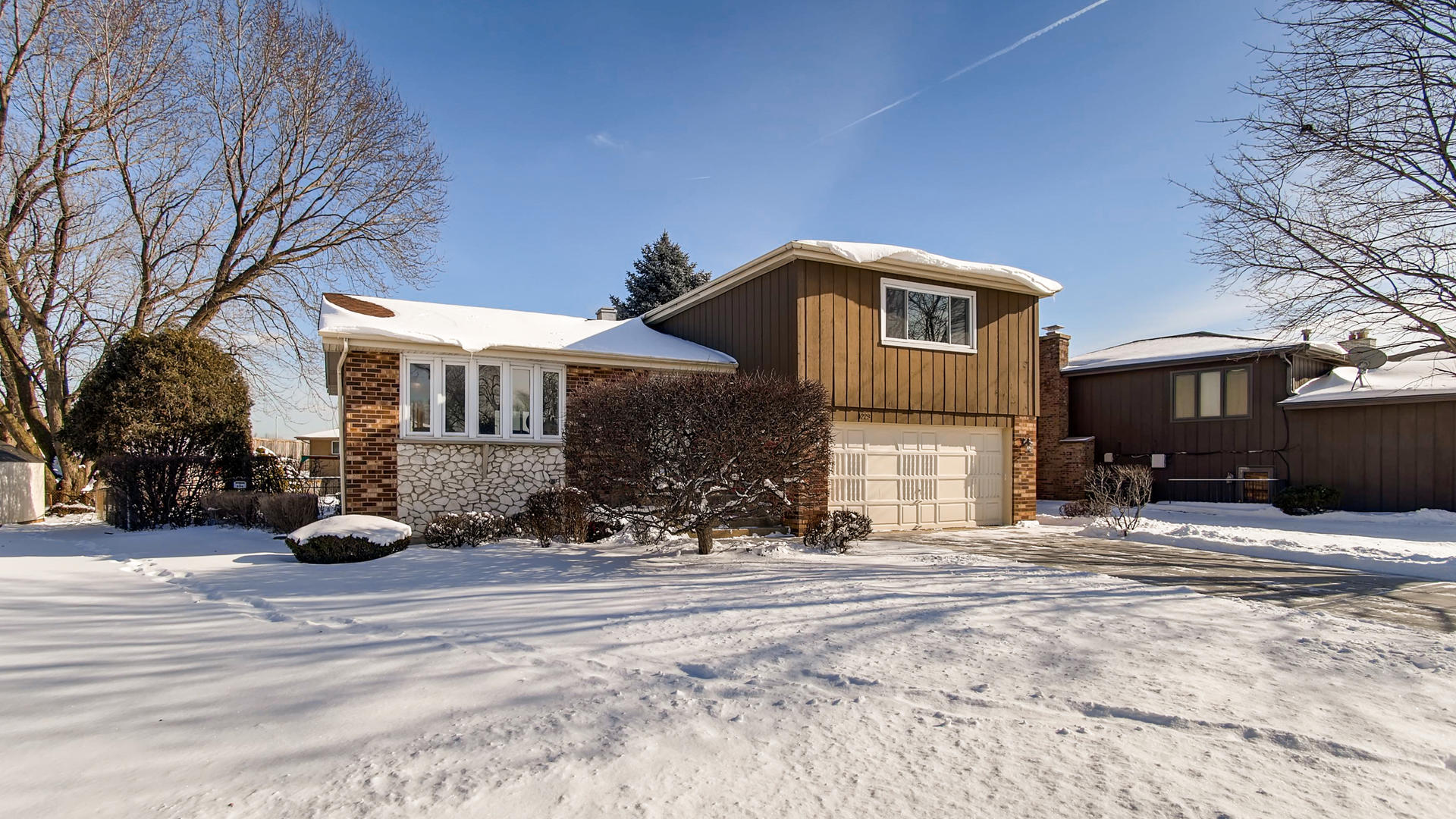 1229 Honey Hill Road Addison, IL 60101 - Photo 1 of 25 a front view of a house with a yard