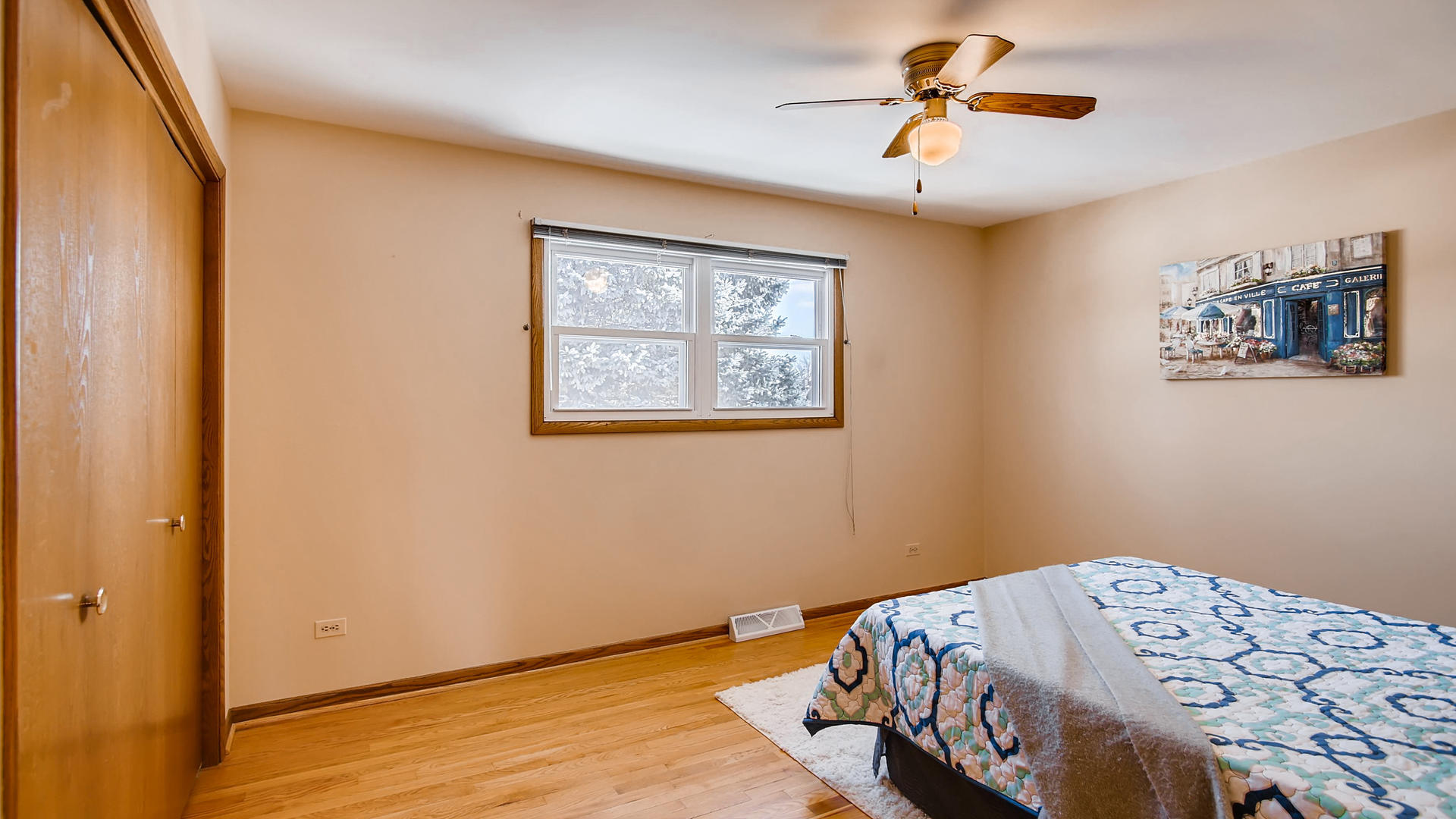 1229 Honey Hill Road Addison, IL 60101 - Photo 12 of 25 a bedroom with a bed and a chandelier