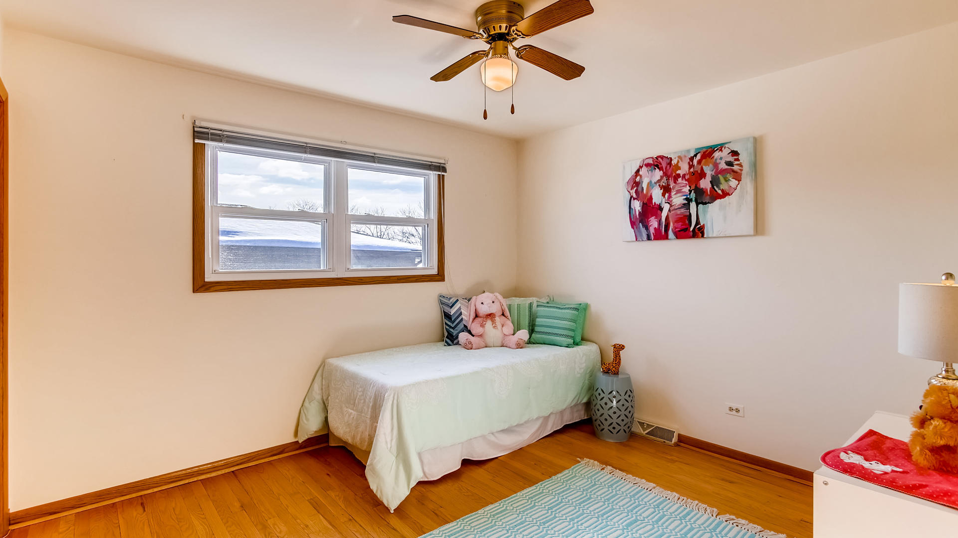 1229 Honey Hill Road Addison, IL 60101 - Photo 13 of 25 a bedroom with a bed and wooden floor