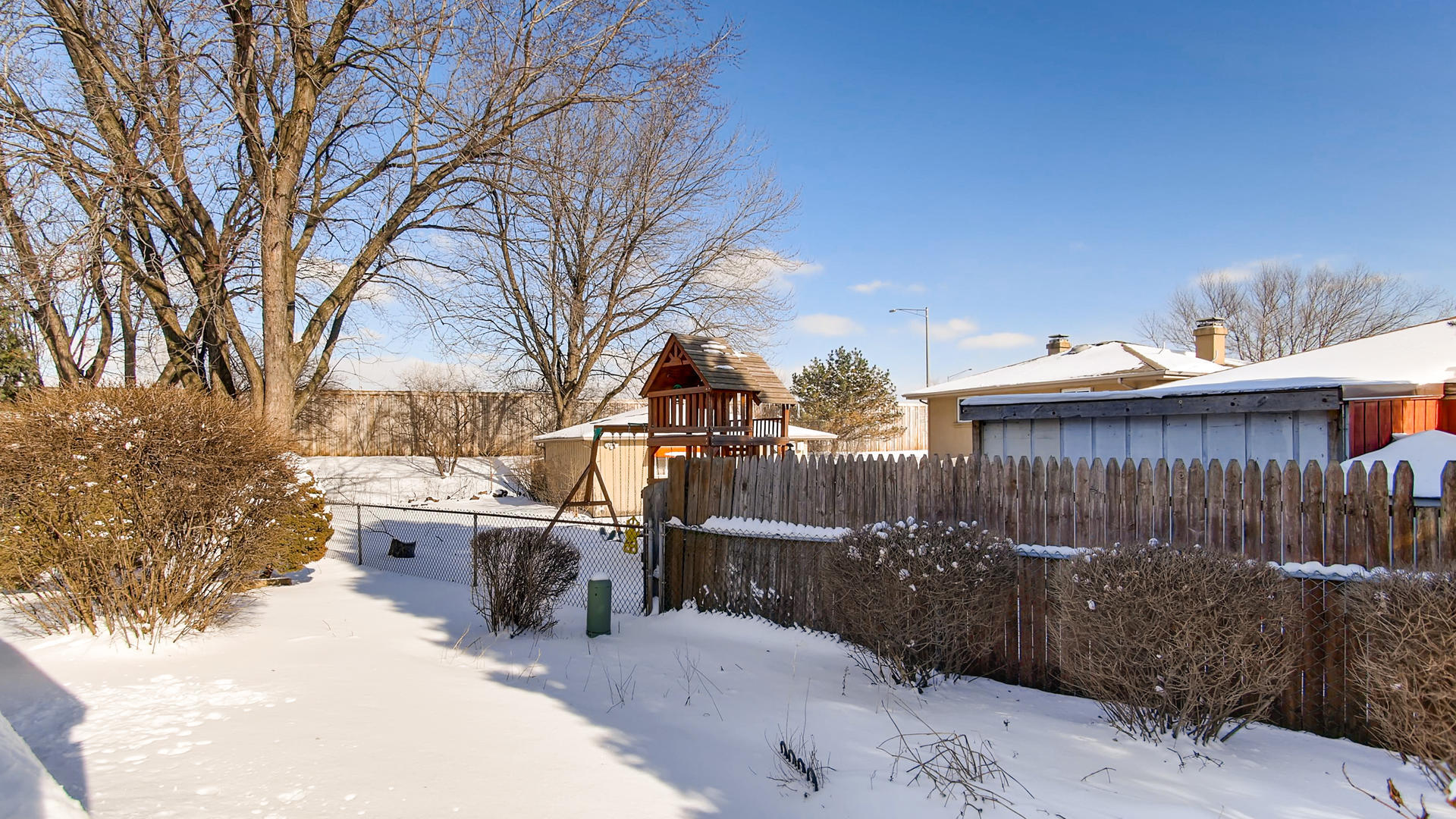 1229 Honey Hill Road Addison, IL 60101 - Photo 22 of 25 a view of a patio with iron fence