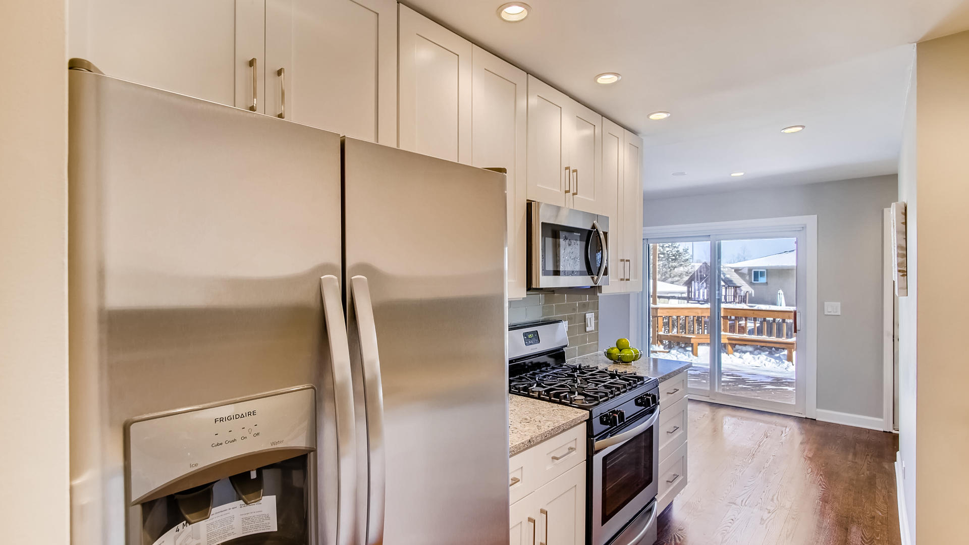 1229 Honey Hill Road Addison, IL 60101 - Photo 8 of 25 a kitchen with stainless steel appliances a refrigerator a stove a sink and a refrigerator
