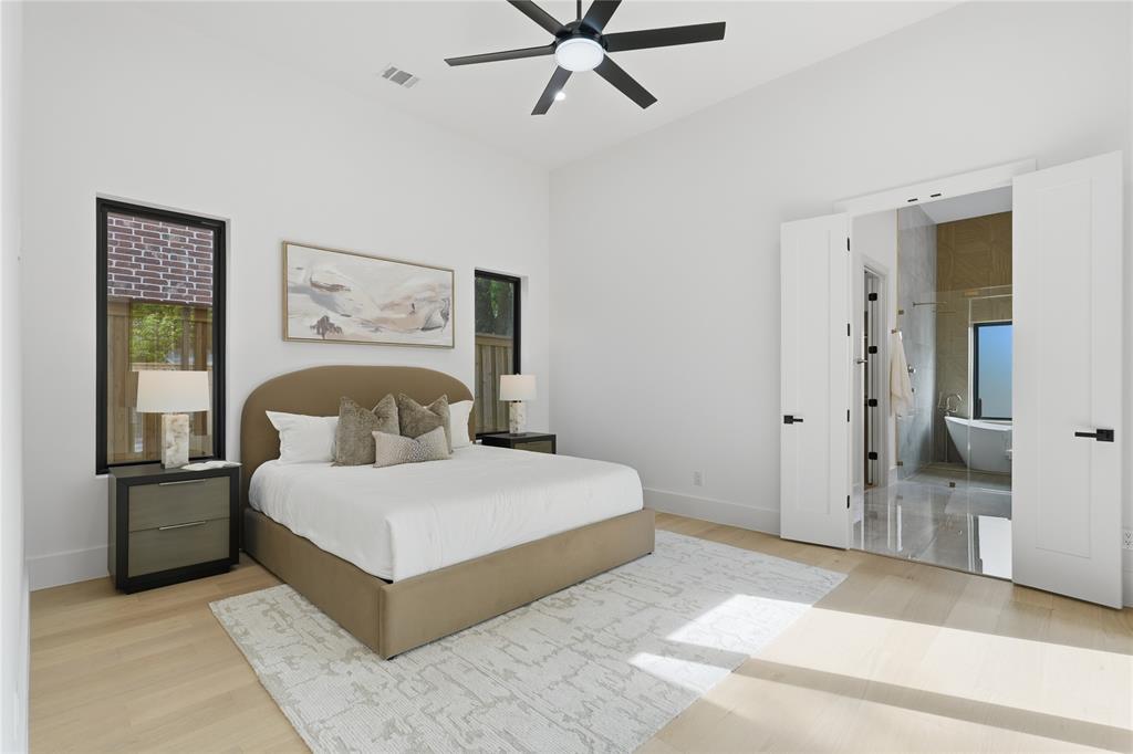 6038 Prospect Avenue Dallas, TX 75206 - Photo 17 of 40 Vaulted ceilings enhance this space featuring light wood-finish flooring and a contemporary black ceiling fan