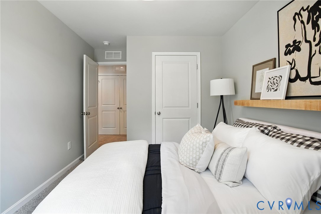 3505 Perrins Hill Way Prince George, VA 23875 - Photo 10 of 24 a bedroom with a bed and a lamp