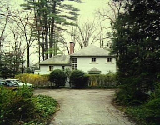 996 Sunset Road Stamford, CT 06903 - Photo 1 of 1 a front view of a house with a yard