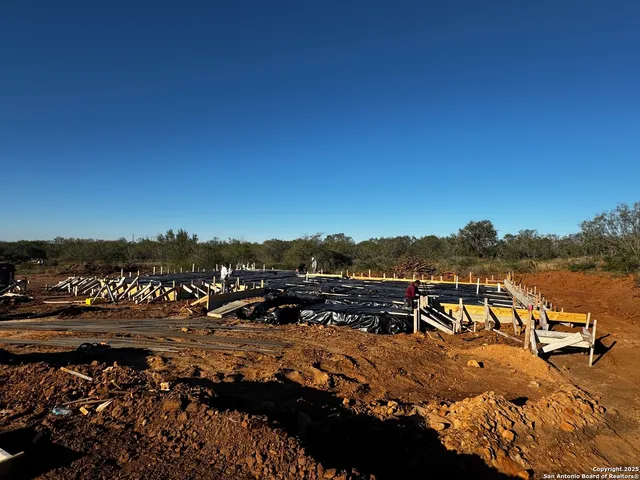 a view of a terrace with couches and sky view