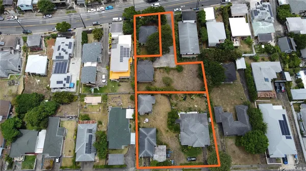 an aerial view of residential houses with outdoor space