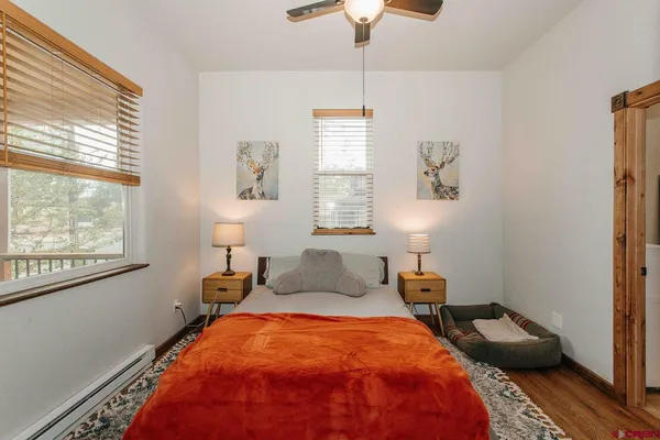 a bedroom with bed and window