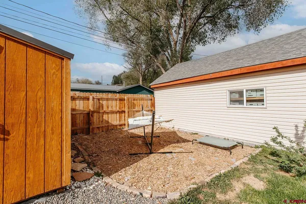 a backyard of a house with seating space