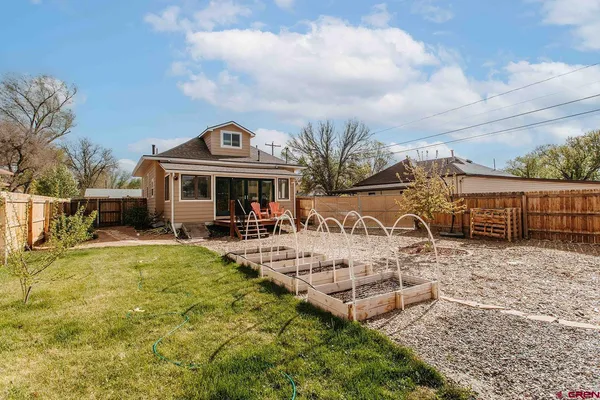 a view of a house with swimming pool and sitting area