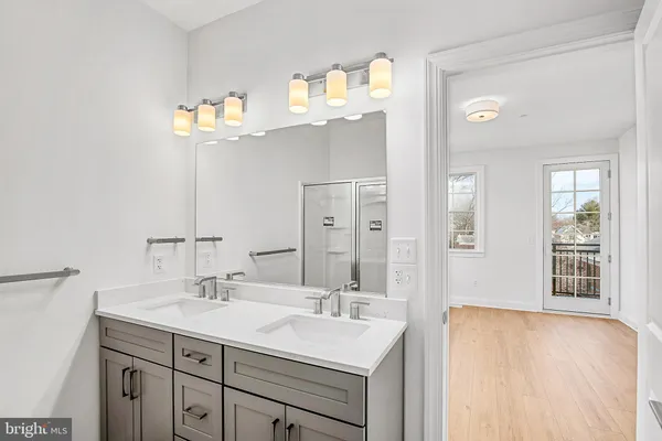 a bathroom with a sink a vanity and a mirror