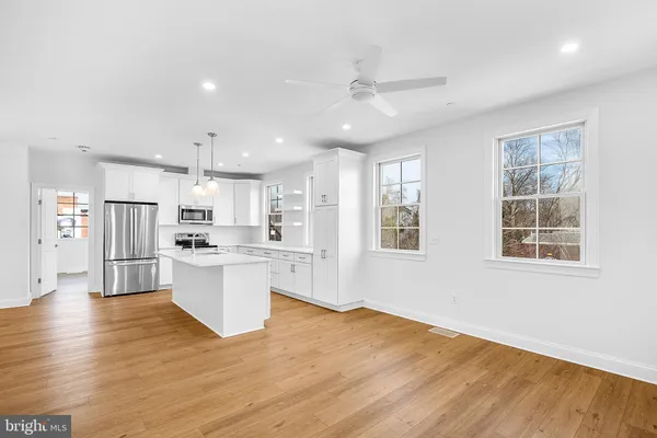 a view of kitchen with wooden floor and window