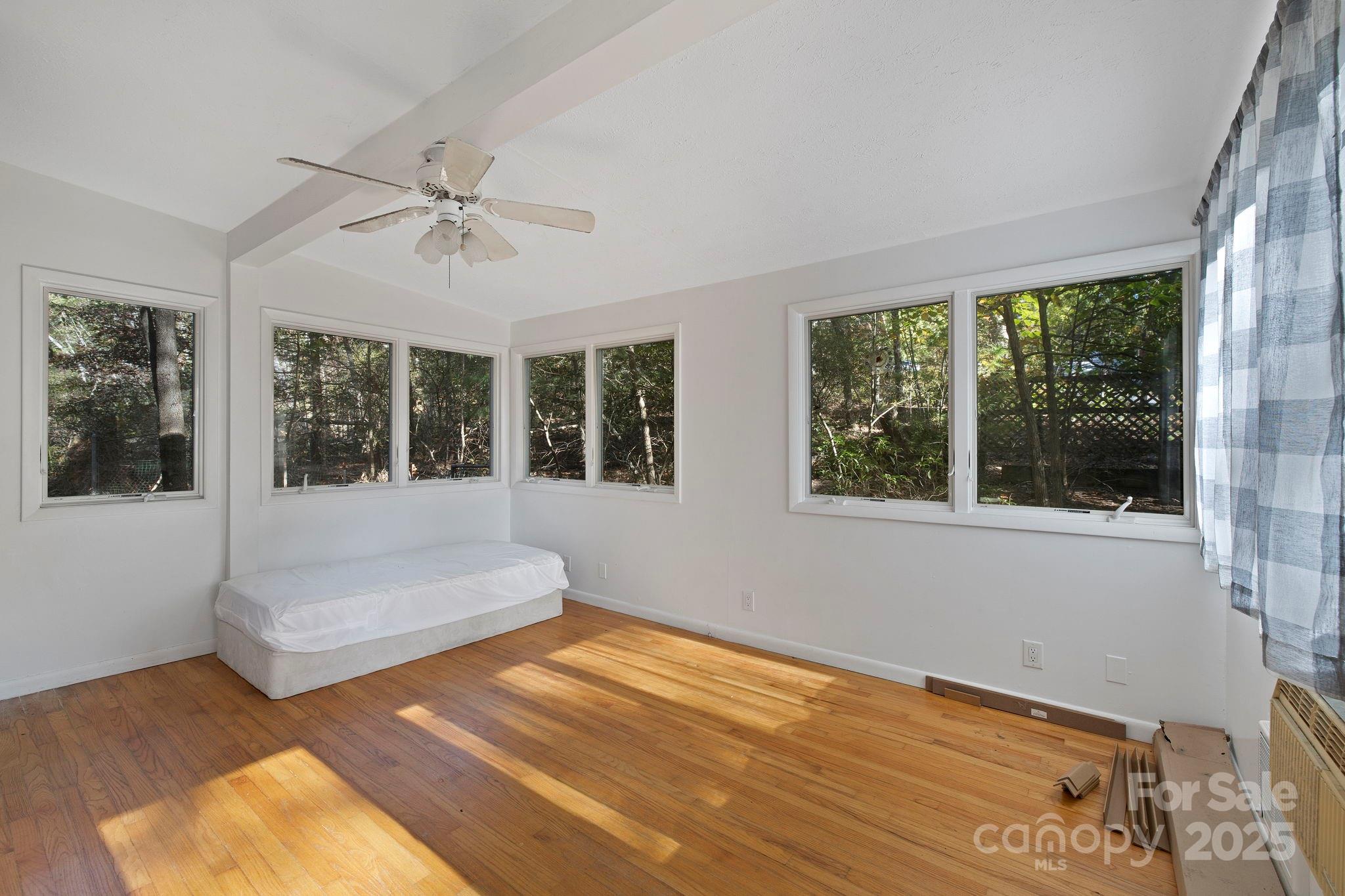 95 Temple Road Black Mountain, NC 28711 - Photo 11 of 30 a spacious bedroom with a large bed and a window