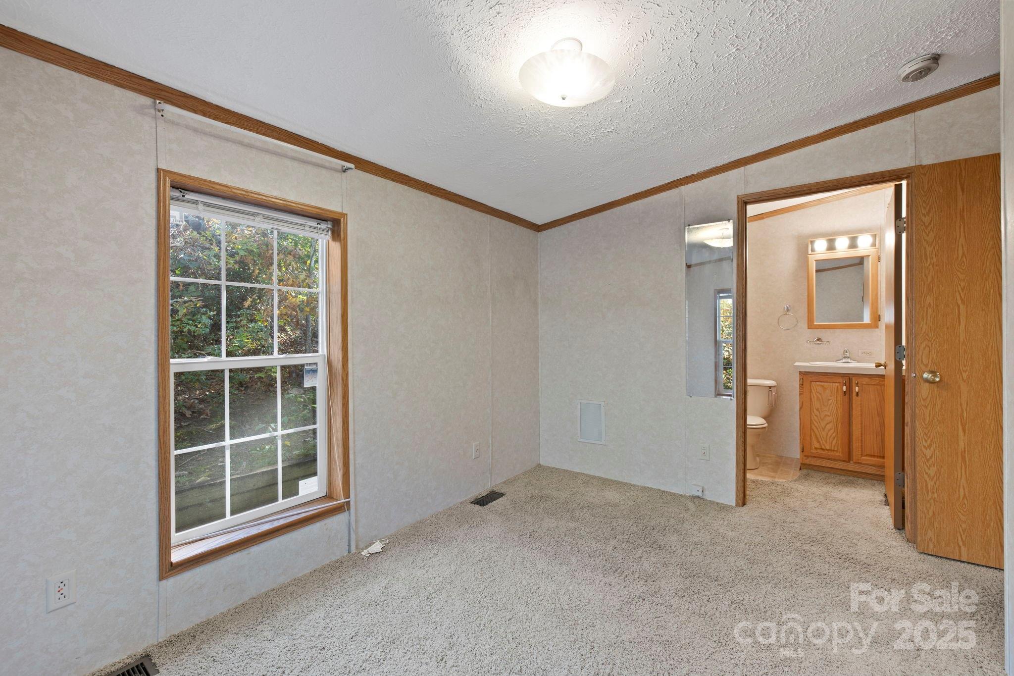 95 Temple Road Black Mountain, NC 28711 - Photo 26 of 30 an empty room with a window