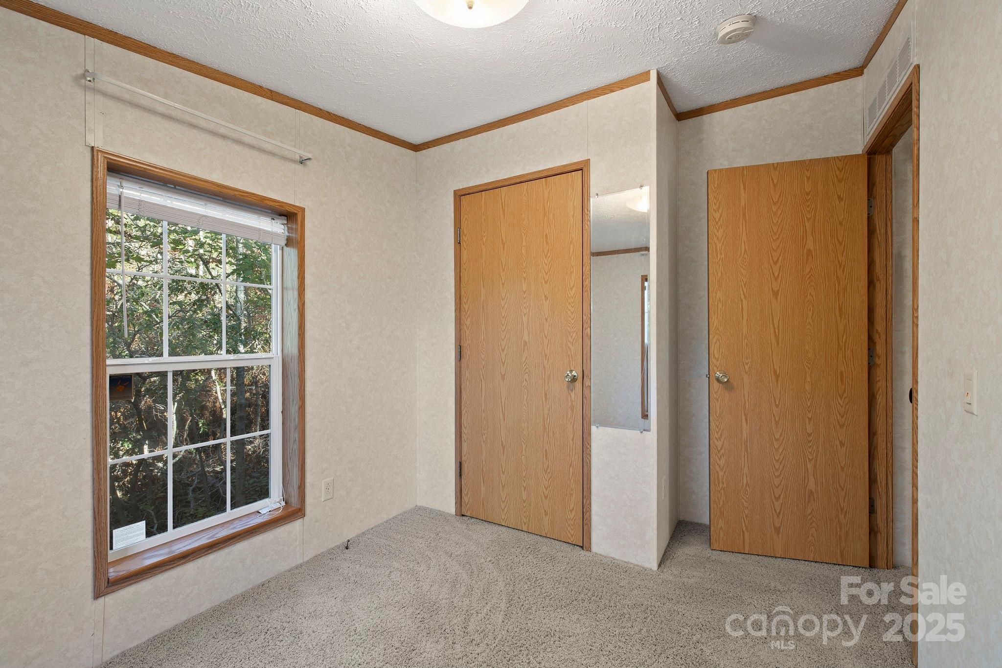 95 Temple Road Black Mountain, NC 28711 - Photo 28 of 30 a view of an empty room with a window