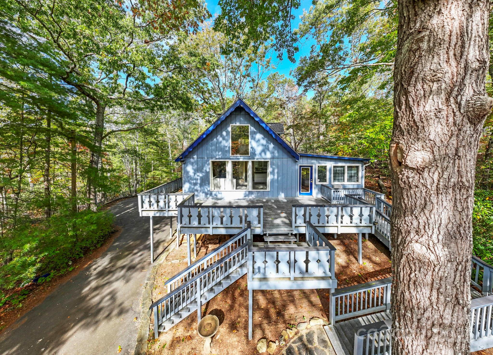 95 Temple Road Black Mountain, NC 28711 - Photo 3 of 30 a view of a house with backyard and sitting area