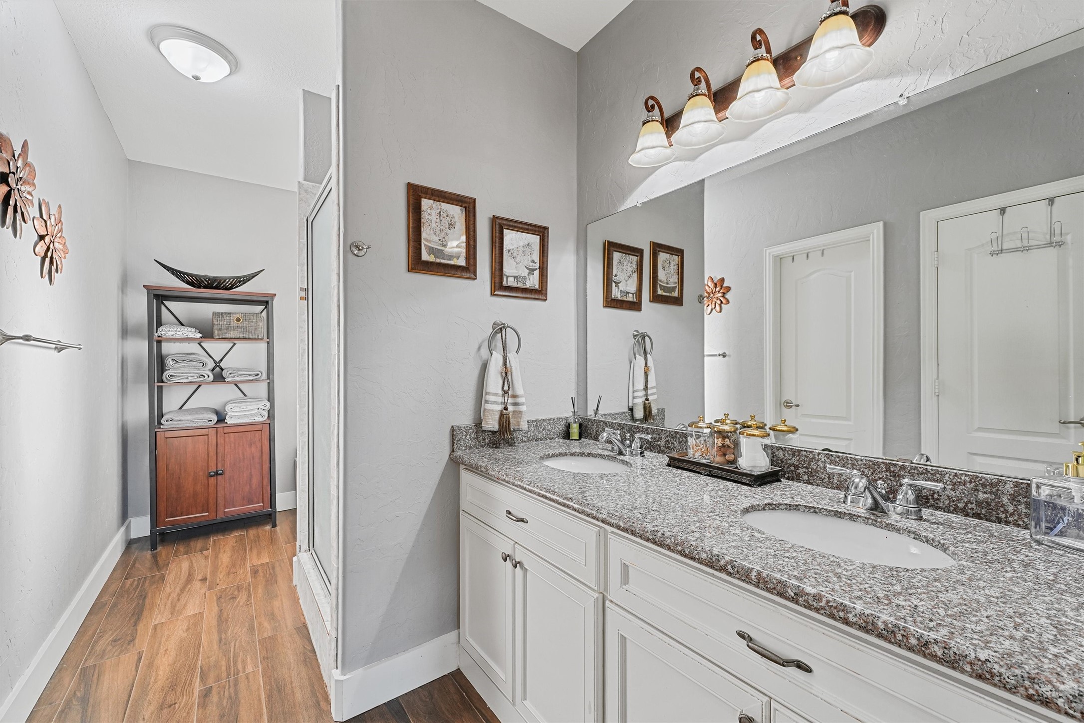 19545 Crosby Eastgate Road Crosby, TX 77532 - Photo 18 of 27 a bathroom with a sink double vanity granite tub and shower