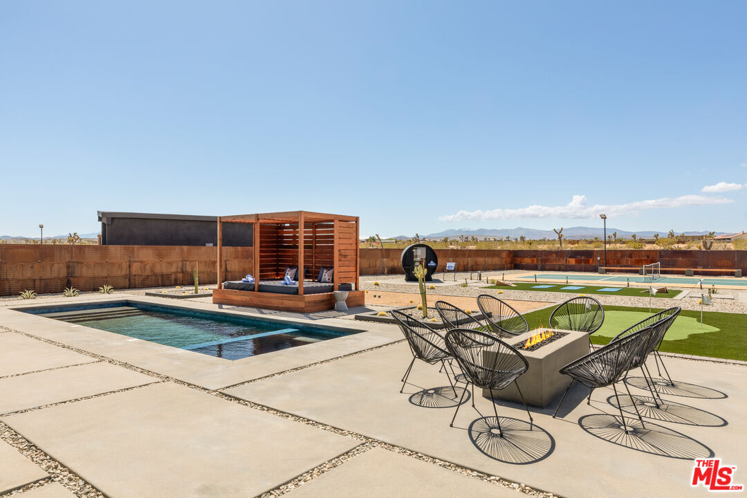 3000 Rockwood Road Joshua Tree, CA 92252 - Photo 64 of 71 a view of swimming pool with outdoor seating and plants