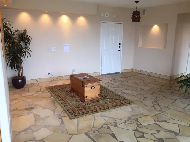 a living room with a rug