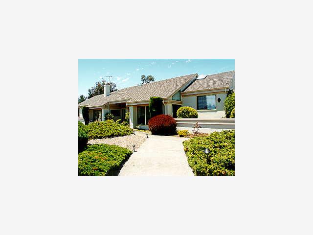 755 Darrell Road Hillsborough, CA 94010 - Photo 1 of 1 a view of a patio with a table and chairs under an umbrella