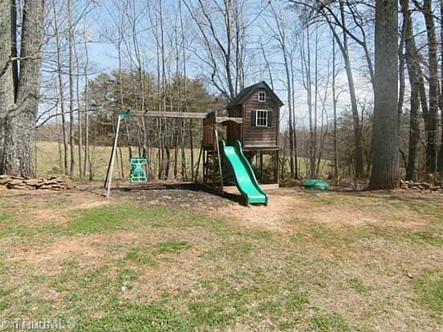 2840 Collinstown Road Westfield, NC 27053 - Photo 14 of 16 Exterior Back. This play set in the back yard stays with the home