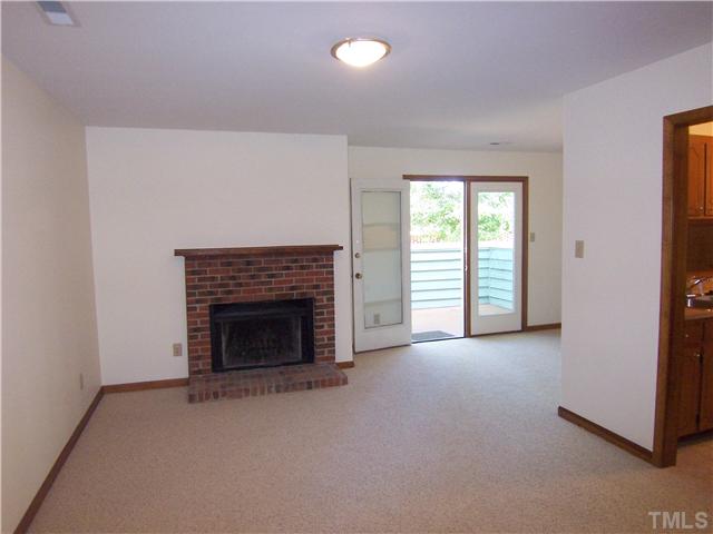 3201 Mill Run Raleigh, NC 27612 - Photo 3 of 12 New paint and quality carpet just installed. New light fixtures. A feature brick fireplace with wood mantel. A bright spacious living area.