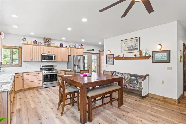 a dining room with furniture and window