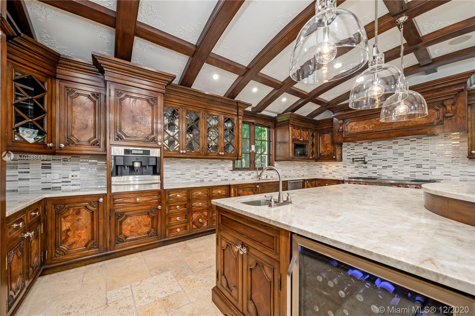 12704 Stonebrook Drive Davie, FL 33330 - Photo 11 of 57 a kitchen with stainless steel appliances granite countertop a sink a stove and cabinets