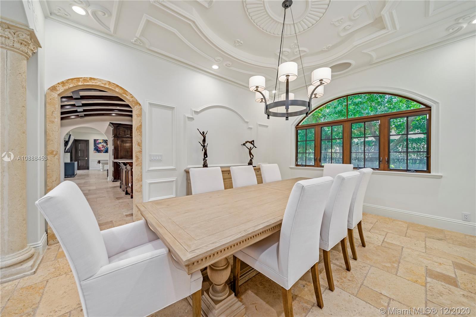12704 Stonebrook Drive Davie, FL 33330 - Photo 13 of 57 a view of a dining room with furniture a chandelier and a window