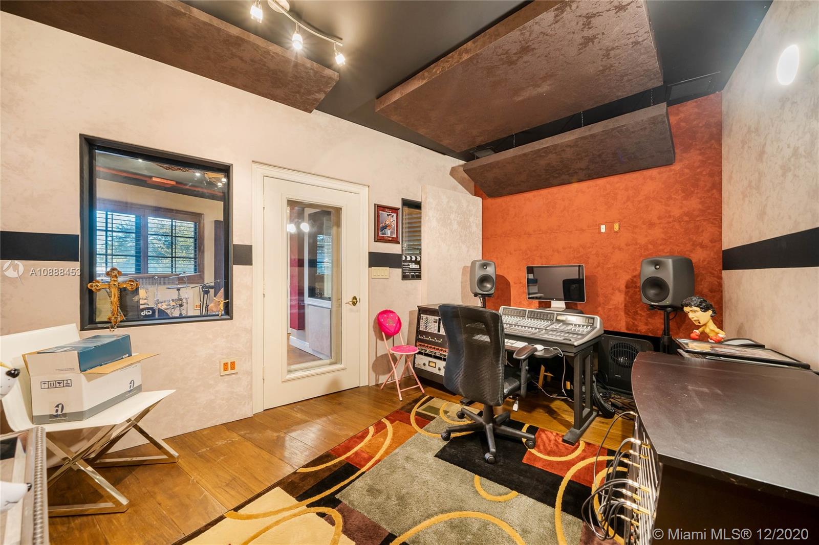 12704 Stonebrook Drive Davie, FL 33330 - Photo 20 of 57 a living room with furniture and a large window