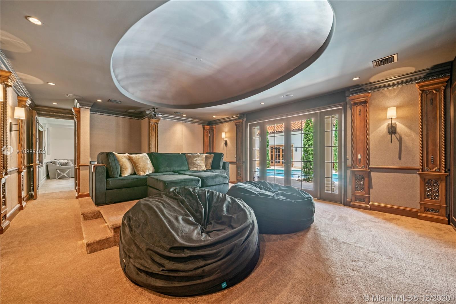 12704 Stonebrook Drive Davie, FL 33330 - Photo 26 of 57 a balcony with furniture and a large window