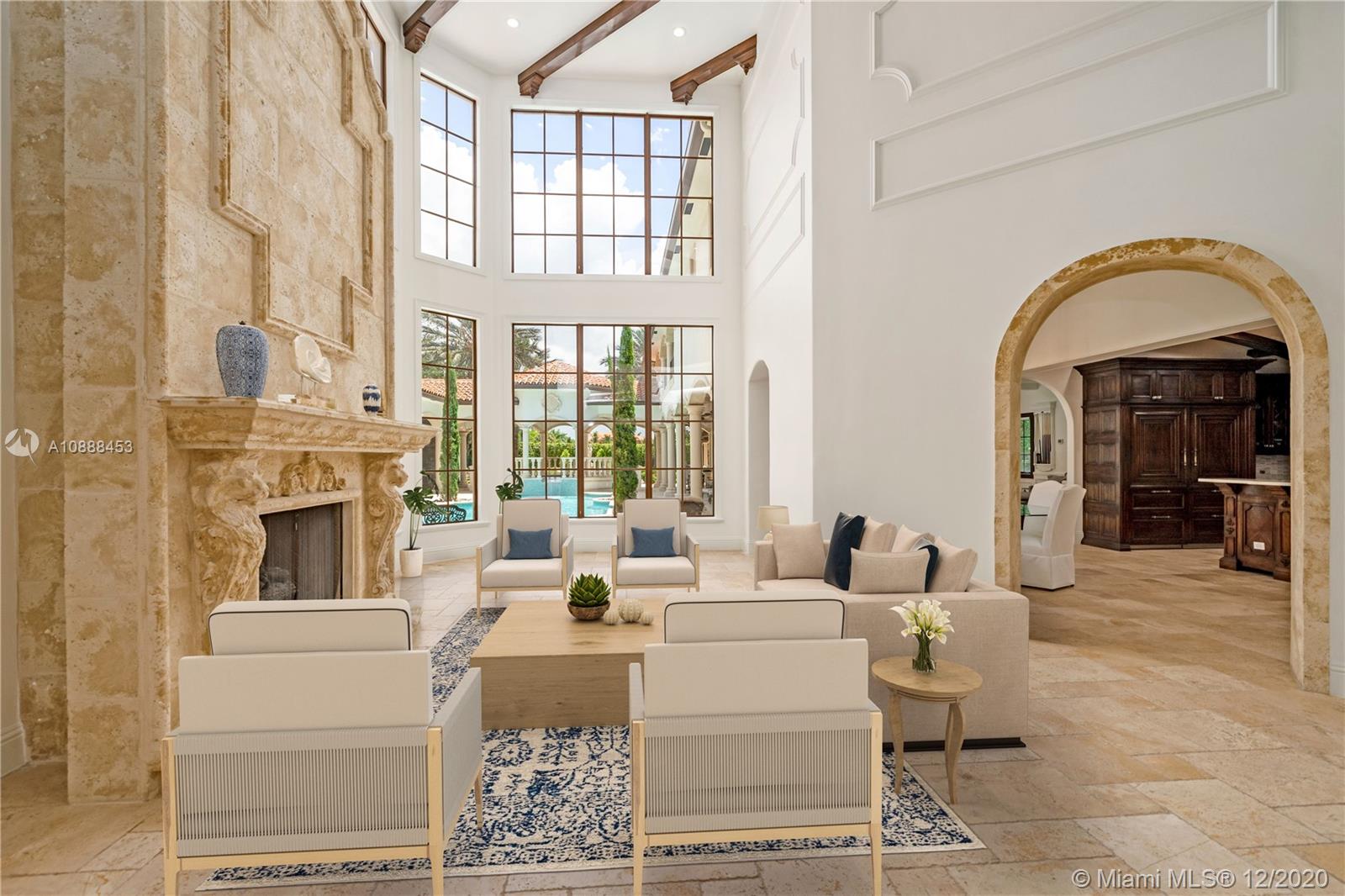 12704 Stonebrook Drive Davie, FL 33330 - Photo 6 of 57 a living room with fireplace furniture and a floor to ceiling window